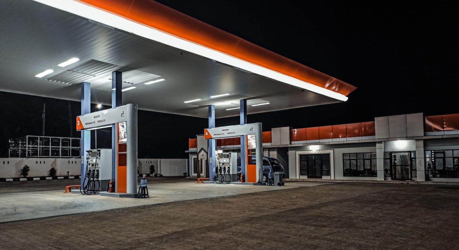 Petrol station forecourt at night
