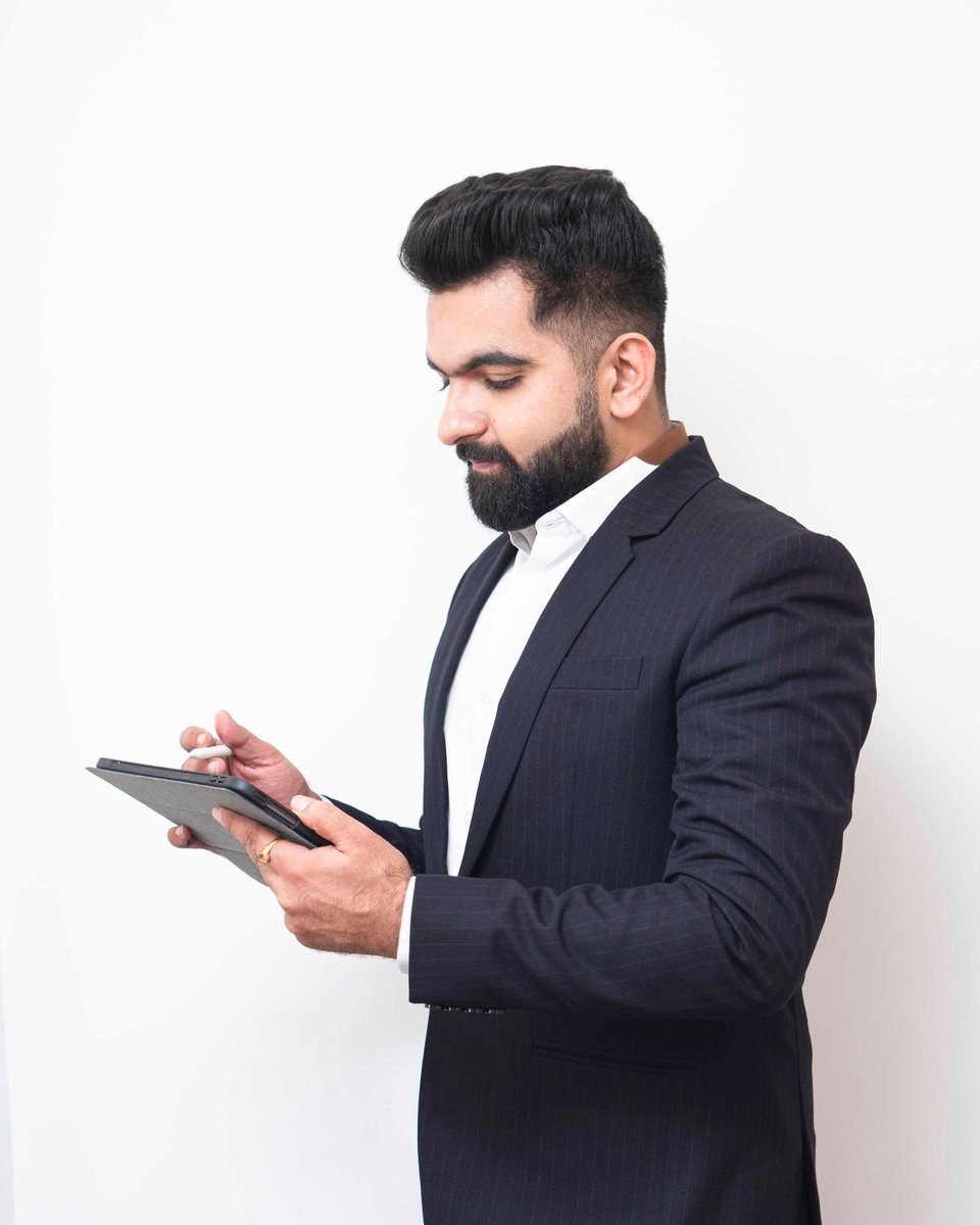 Station owner checking sales on a tablet